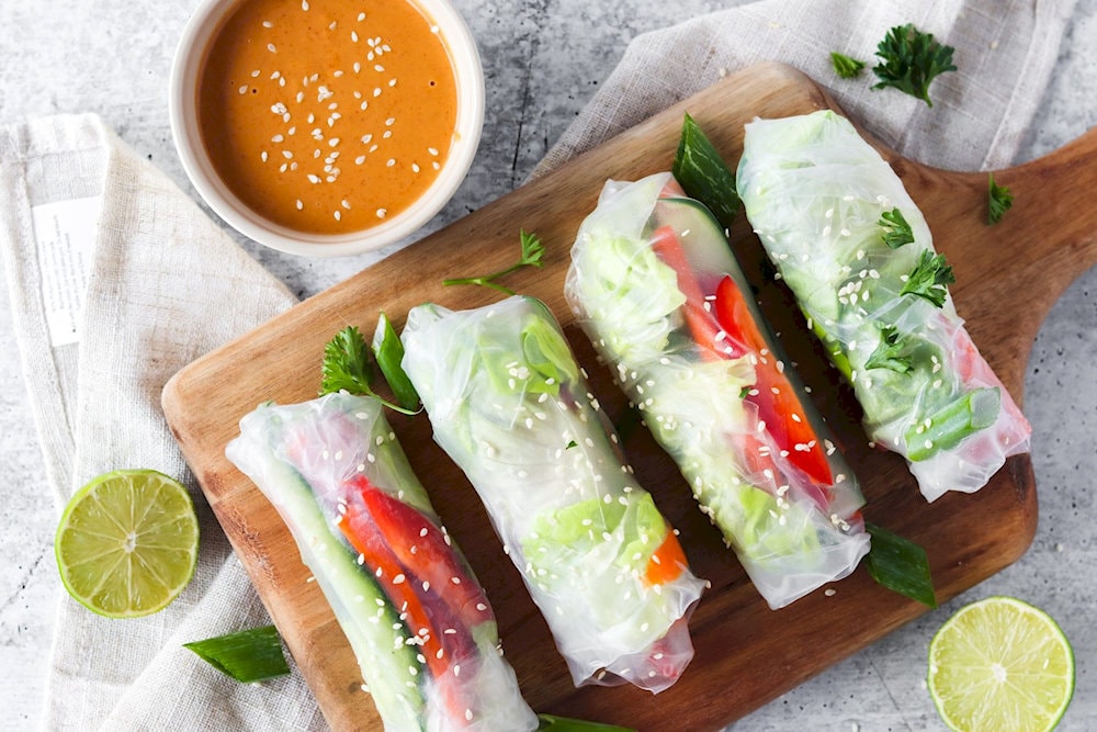 Enjoy vegetarian spring rolls with crispy sweet vegetables, fresh rice noodles, and tofu/mushrooms, dipped in irresistible sweet and sour sauce
